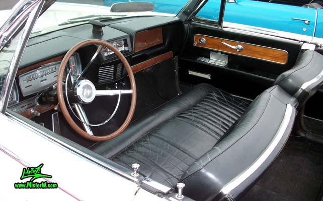 Photo of a white 1962 Lincoln Continental 4 door convertible at the Scottsdale Pavilions Classic Car Show in Arizona. Interior of a 1962 Lincoln Continental convertible