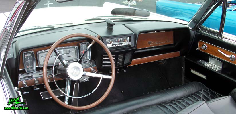 Photo of a white 1962 Lincoln Continental 4 door convertible at the Scottsdale Pavilions Classic Car Show in Arizona. Speedometer & dashboard of a 1962 Lincoln Continental convertible
