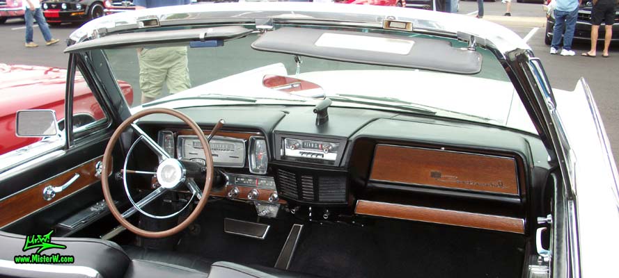 Photo of a white 1962 Lincoln Continental 4 door convertible at the Scottsdale Pavilions Classic Car Show in Arizona. Dash board of a 1962 Lincoln Continental convertible