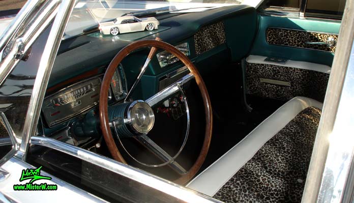 Photo of a white 1963 Lincoln Continental 4 door hardtop sedan at the Scottsdale Pavilions Classic Car Show in Arizona. Dash board & interior of a 1963 Lincoln Continental