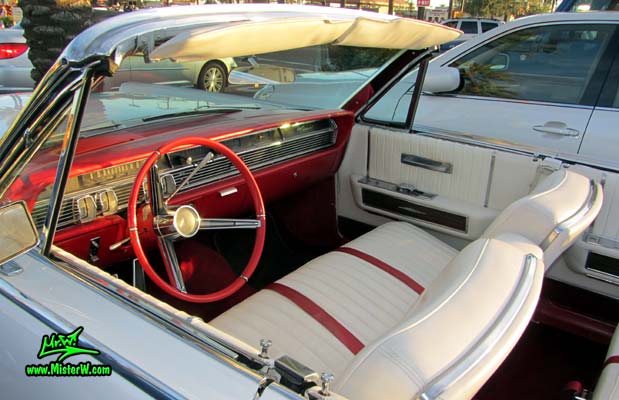 Photo of a white 1964 Lincoln Continental 4 door convertible at the Scottsdale Pavilions Classic Car Show in Arizona. Interior of a 1964 Lincoln Continental convertible
