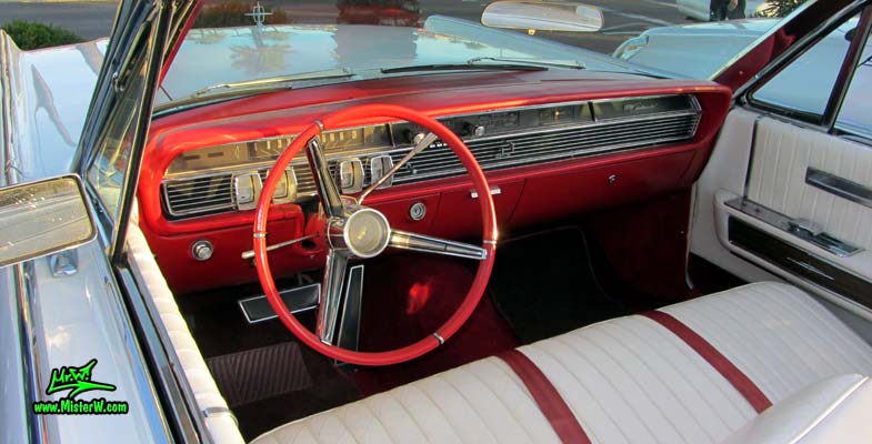 Photo of a white 1964 Lincoln Continental 4 door convertible at the Scottsdale Pavilions Classic Car Show in Arizona. Dashboard of a 1964 Lincoln Continental convertible