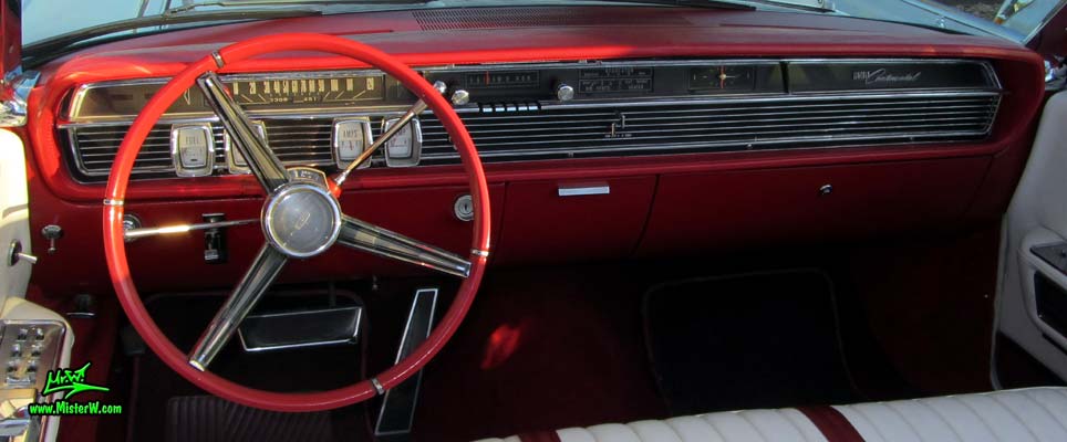 Photo of a white 1964 Lincoln Continental 4 door convertible at the Scottsdale Pavilions Classic Car Show in Arizona. Dash board & speedometer of a 1964 Lincoln Continental convertible