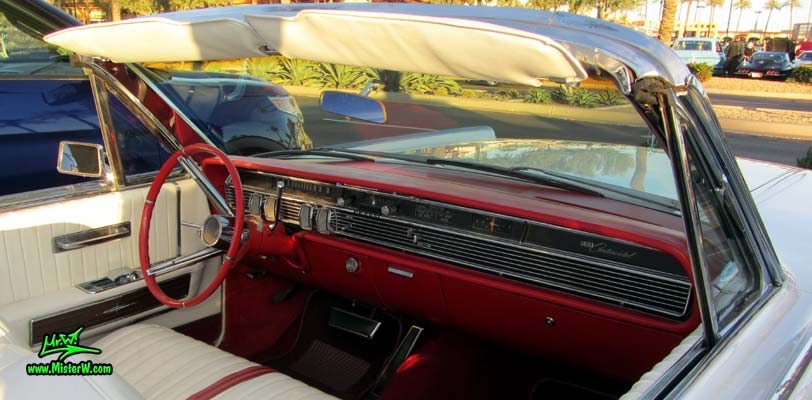 Photo of a white 1964 Lincoln Continental 4 door convertible at the Scottsdale Pavilions Classic Car Show in Arizona. Dashboard & steering column of a 1964 Lincoln Continental convertible