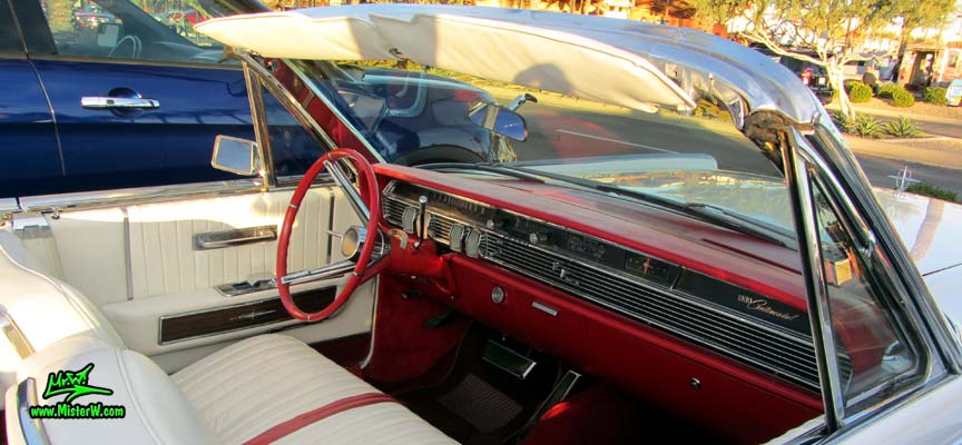 Photo of a white 1964 Lincoln Continental 4 door convertible at the Scottsdale Pavilions Classic Car Show in Arizona. Dash board & interior of a 1964 Lincoln Continental convertible