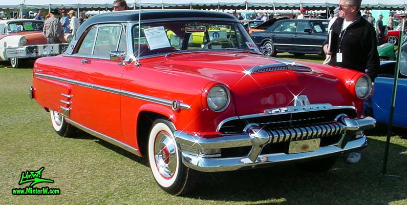 Photo of a red 1954 Mercury Monterey 2 Door Hardtop Coupe at a Classic Car Auction in Scottsdale, Arizona. 1954 Mercury Monterey Coupe Frontview