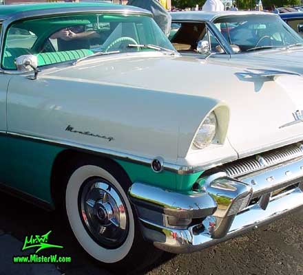 Photo of a white & turkquoise 1956 Mercury Monterey 4 Door Hardtop Sedan at the Scottsdale Pavilions Classic Car Show in Arizona. 1956 Mercury Head Light