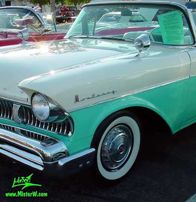 Photo of a white & turkquoise 1957 Mercury Monterey 2 Door Convertible at the Scottsdale Pavilions Classic Car Show in Arizona. 1957 Mercury Head Light