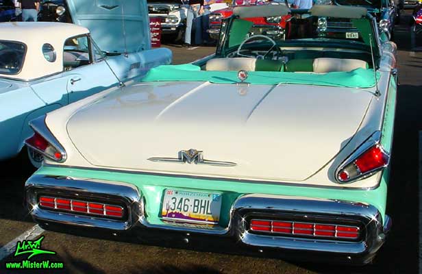 Photo of a white & turkquoise 1957 Mercury Monterey 2 Door Convertible at the Scottsdale Pavilions Classic Car Show in Arizona. 1957 Mercury Rearview