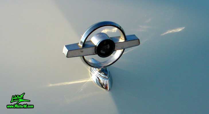 Photo of a white & turkquoise 1957 Mercury Monterey 2 Door Convertible at the Scottsdale Pavilions Classic Car Show in Arizona. 1957 Mercury Hood Ornament