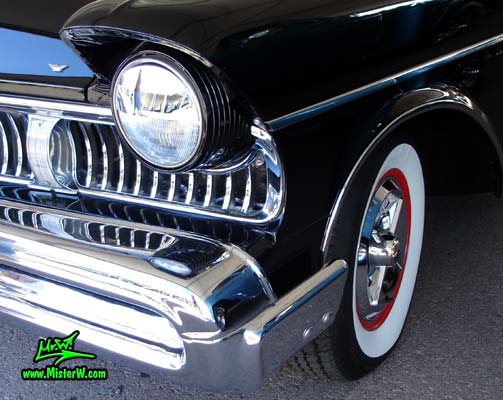 Photo of a black 1957 Mercury 2 Door Hardtop Coupe at a classic car auction in Scottsdale, Arizona. Head Light of a 57 Mercury 2 Door Hardtop Coupe