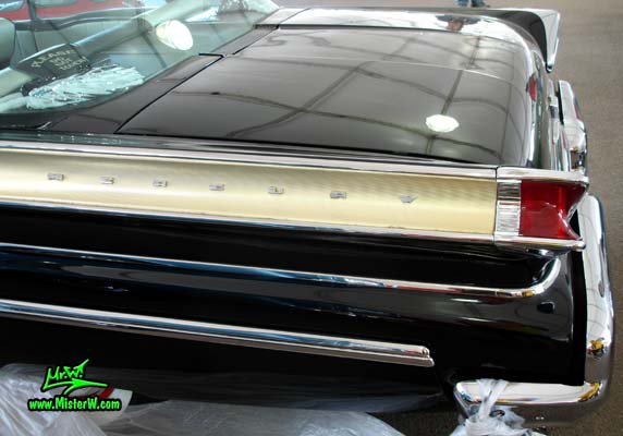 Photo of a black 1957 Mercury 2 Door Hardtop Coupe at a classic car auction in Scottsdale, Arizona. Tail Fin of a 57 Mercury Hardtop Coupe