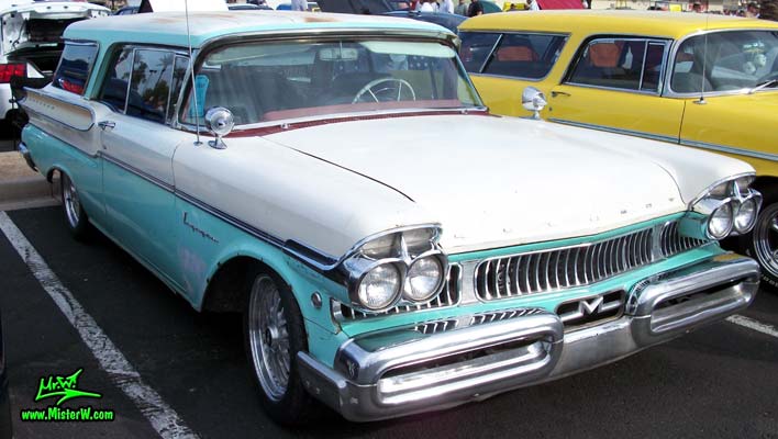 Photo of a white & turkquoise 1957 Mercury Voyager 2 Door Station Wagon at the Scottsdale Pavilions Classic Car Show in Arizona. 57 Mercury Voyager 2 Door Station Wagon Front Chrome Grill