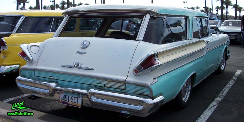 Photo of a white & turkquoise 1957 Mercury Voyager 2 Door Station Wagon at the Scottsdale Pavilions Classic Car Show in Arizona. 57 Mercury Voyager 2 Door Station Wagon Fins & Tailgate