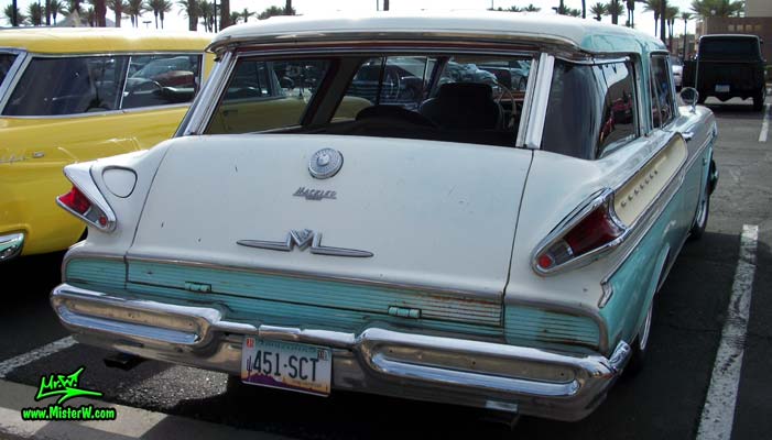 Photo of a white & turkquoise 1957 Mercury Voyager 2 Door Station Wagon at the Scottsdale Pavilions Classic Car Show in Arizona. 57 Mercury Wagon Tail Fins & Back Door