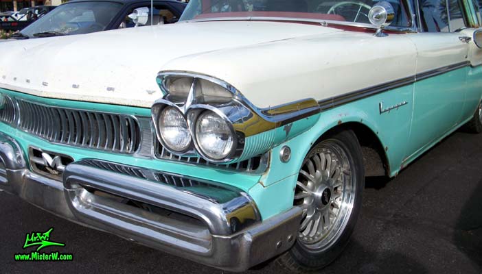 Photo of a white & turkquoise 1957 Mercury Voyager 2 Door Station Wagon at the Scottsdale Pavilions Classic Car Show in Arizona. Massive Chrome Bumper of a 57 Mercury Voyager 2 Door Stationwagon