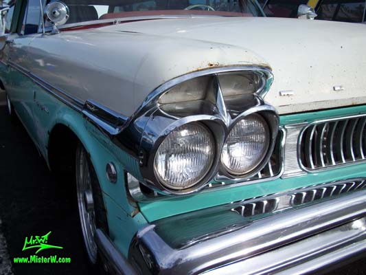 Photo of a white & turkquoise 1957 Mercury Voyager 2 Door Station Wagon at the Scottsdale Pavilions Classic Car Show in Arizona. 57 Mercury Voyager 2 Door Stationwagon Head Light