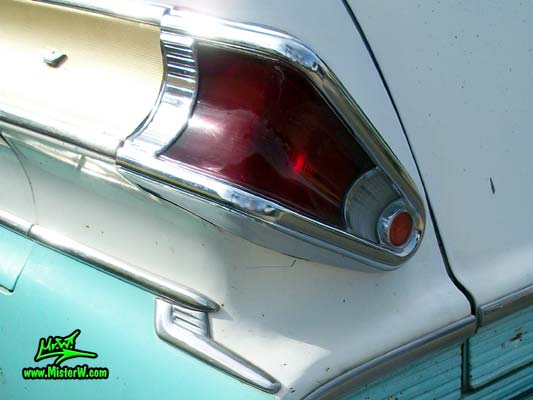 Photo of a white & turkquoise 1957 Mercury Voyager 2 Door Station Wagon at the Scottsdale Pavilions Classic Car Show in Arizona. 57 Mercury Voyager 2 Door Stationwagon Tail Light