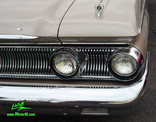 Photo of a beige 1960 Mercury Monterey 2 Door Hardtop Coupe at the Scottsdale Pavilions Classic Car Show in Arizona. 1960 Mercury Head Lights & Chrome
