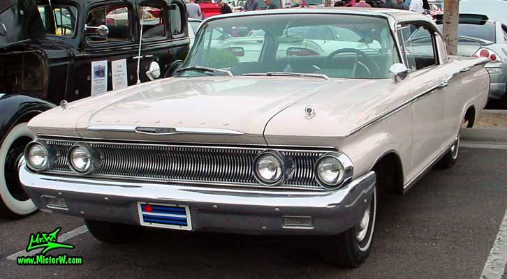 Photo of a white 1960 Mercury Monterey 4 Door Hardtop Sedan at the Scottsdale Pavilions Classic Car Show in Arizona. 60 Mercury Sedan