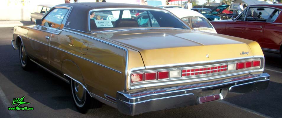 Photo of a gold brown 1973 Mercury 2 door hartop coupe at the Scottsdale Pavilions Classic Car Show in Arizona. Rearview of a 1973 Mercury Hartop Coupe