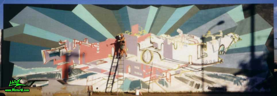 Photo of artist & muralist Werner Skolimowski painting a abstract wall mural in Phoenix, Arizona in 1999. Werner Skolimowski Painting a Abstract Wall Mural in Phoenix, Arizona