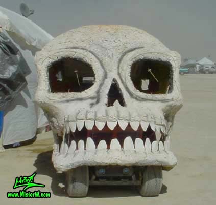 Photo of a white Skull Mutant Vehicle / Art Car in Black Rock City, Nevada, 2004. White Skull Mutant Vehicle