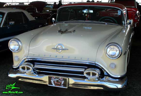 Photo of a white 1954 Oldsmobile 2 Door Hardtop Coupe at a Classic Car Auction in Scottsdale, Arizona. 1954 Oldsmobile