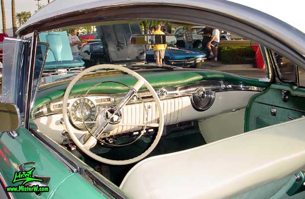 Photo of a white & turkquoise 1955 Oldsmobile 4 Door Hardtop Sedan at the Scottsdale Pavilions Classic Car Show in Arizona. 1955 Oldsmobile Odometer & Dash Board