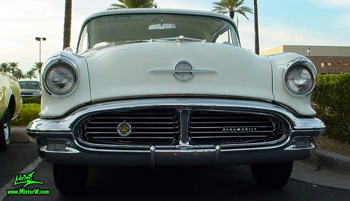 Photo of a white & yellow 1956 Oldsmobile 2 Door Hardtop Coupe at the Scottsdale Pavilions Classic Car Show in Arizona. 1956 Oldsmobile Coupe Frontview