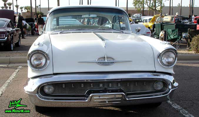 Photo of a white 1957 Oldsmobile 4 Door Hardtop Sedan at the Scottsdale Pavilions Classic Car Show in Arizona. 57 Olds Frontview