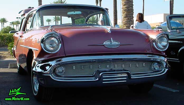 Photo of a pink 1957 Oldsmobile 4 Door Hardtop Station Wagon at the Scottsdale Pavilions Classic Car Show in Arizona. 1957 Oldsmobile Wagon Frontview