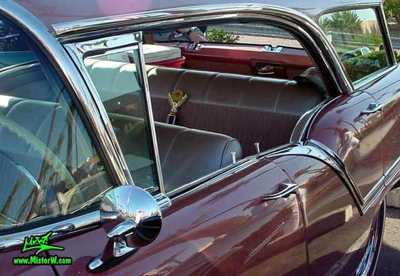 Photo of a pink 1957 Oldsmobile 4 Door Hardtop Station Wagon at the Scottsdale Pavilions Classic Car Show in Arizona. Postless 1957 Oldsmobile 4 Door Station Wagon