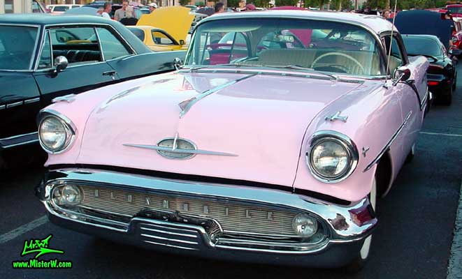 Photo of a pink 1957 Oldsmobile 2 Door Hardtop Coupe at the Scottsdale Pavilions Classic Car Show in Arizona. 1957 Oldsmobile