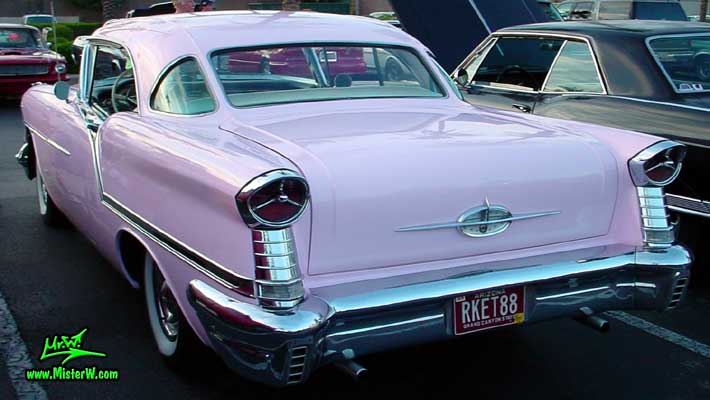 Photo of a pink 1957 Oldsmobile 2 Door Hardtop Coupe at the Scottsdale Pavilions Classic Car Show in Arizona. 1957 Oldsmobile Sideview