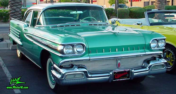 Photo of a green 1958 Oldsmobile 4 Door Hardtop Sedan at a Classic Car Meeting in Arizona. 1958 Oldsmobile 98 Chrome Grill