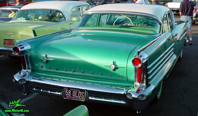 Photo of a green 1958 Oldsmobile 4 Door Hardtop Sedan at a Classic Car Meeting in Arizona. 1958 Oldsmobile Ninety Eight Fins