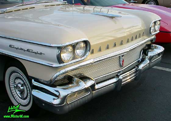 Photo of a beige 1958 Oldsmobile 2 Door Hardtop Coupe at the Scottsdale Pavilions Classic Car Show in Arizona. 1958 Oldsmobile Front Bumper & Chrome Grill