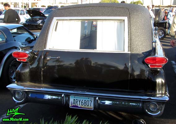 Photo of a black 1959 Oldsmobile Hearse at the Scottsdale Pavilions Classic Car Show in Arizona. Taillights of a 1959 Oldsmobile Hearse