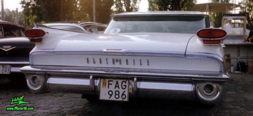 Photo of a white & brown 1959 Oldsmobile 4 Door Hardtop Sedan at a Classic Car Meeting in Germany. 59 Olds Rearview