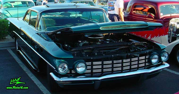 Photo of a blue 1960 Oldsmobile 2 Door Hardtop Coupe at the Scottsdale Pavilions Classic Car Show in Arizona. 60 Olds Coupe