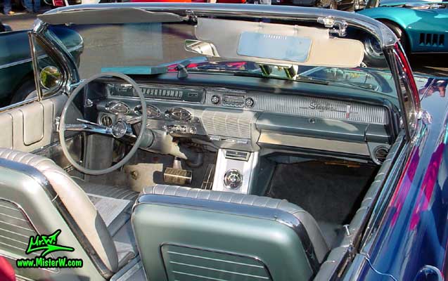 Photo of a blue metallic 1961 Oldsmobile Starfire 2 Door Convertible at the Scottsdale Pavilions Classic Car Show in Arizona. 1961 Oldsmobile Dash Board & Front Seats