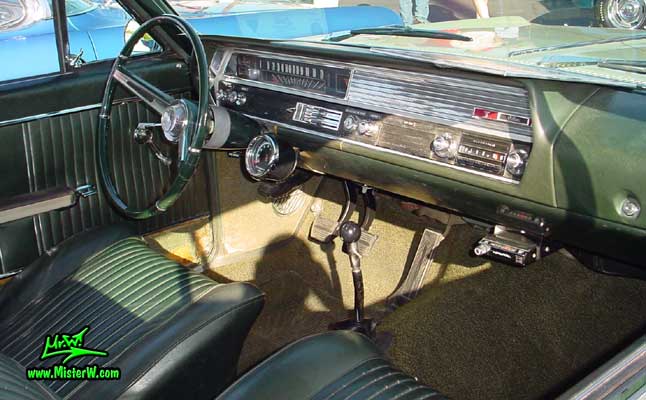 Photo of a olive 1964 Oldsmobile 2 Door Hardtop Coupe at the Scottsdale Pavilions Classic Car Show in Arizona. 1964 Oldsmobile Dashboard & Interior