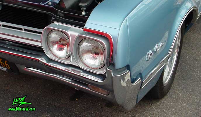 Photo of a blue 1966 Oldsmobile Vista Cruiser 4 Door Station Wagon at the Scottsdale Pavilions Classic Car Show in Arizona. 66 Olds Head Light
