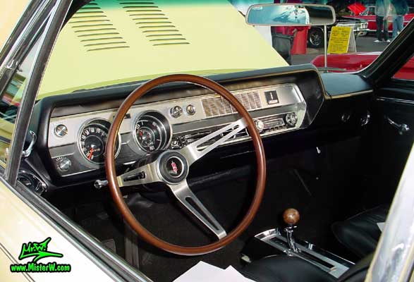 Photo of a yellow 1967 Oldsmobile 2 Door Hardtop Coupe at the Scottsdale Pavilions Classic Car Show in Arizona. 1967 Oldsmobile Dashboard & Interior