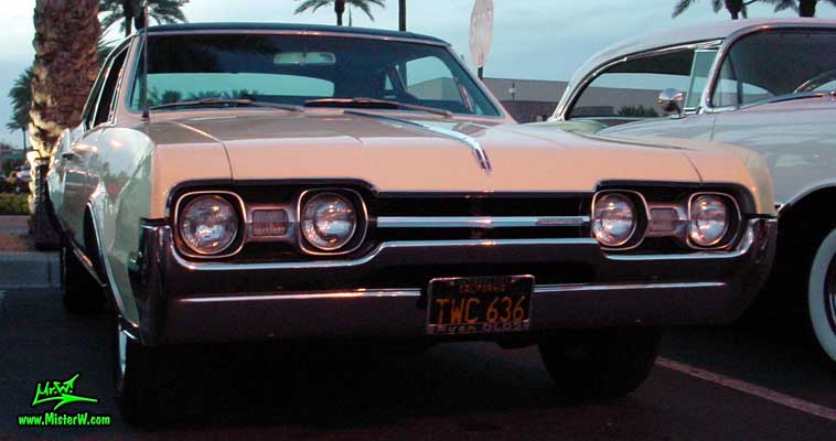 Photo of a white 1967 Oldsmobile Cutlass 2 Door Hardtop Coupe at the Scottsdale Pavilions Classic Car Show in Arizona. 1967 Oldsmobile Cutlass Coupe Frontview