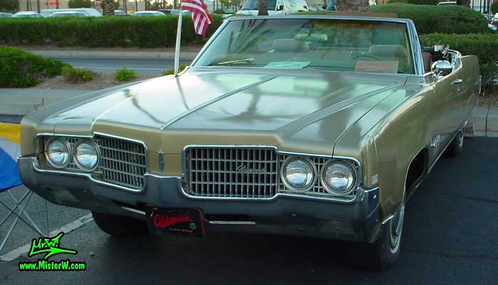 Photo of a gold 1969 Oldsmobile 2 Door Convertible at the Scottsdale Pavilions Classic Car Show in Arizona. Topless 1969 Oldsmobile Convertible