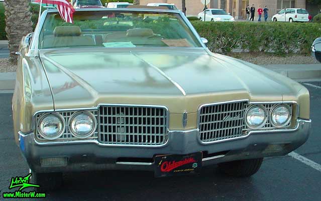 Photo of a gold 1969 Oldsmobile 2 Door Convertible at the Scottsdale Pavilions Classic Car Show in Arizona. 1969 Oldsmobile Convertible Frontview