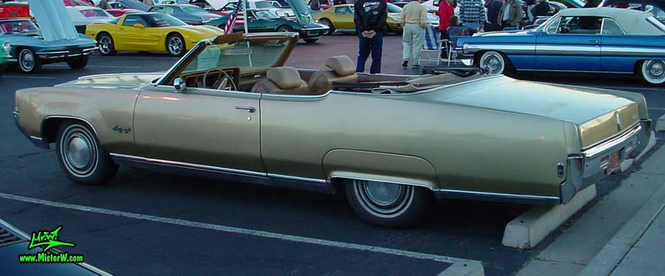 Photo of a gold 1969 Oldsmobile 2 Door Convertible at the Scottsdale Pavilions Classic Car Show in Arizona. 1969 Oldsmobile Convertible Sideview