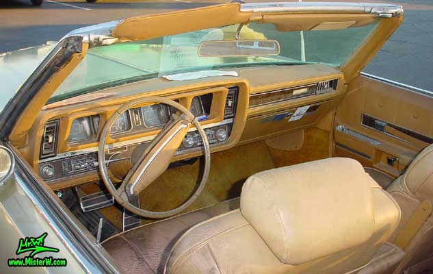 Photo of a gold 1969 Oldsmobile 2 Door Convertible at the Scottsdale Pavilions Classic Car Show in Arizona. 1969 Oldsmobile Odometer & Dash Board